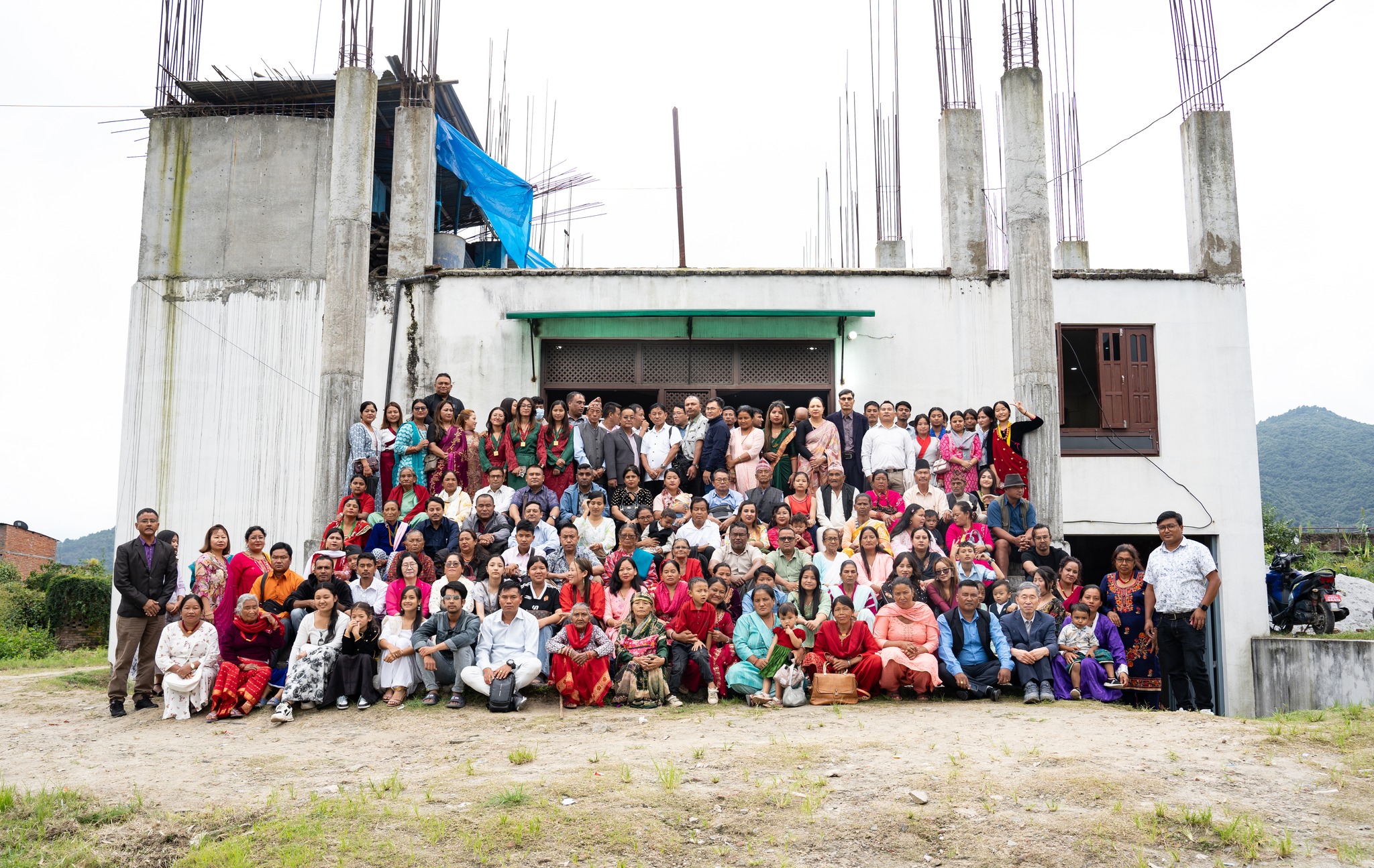 The New Hope Church family gathered together in front of the church building